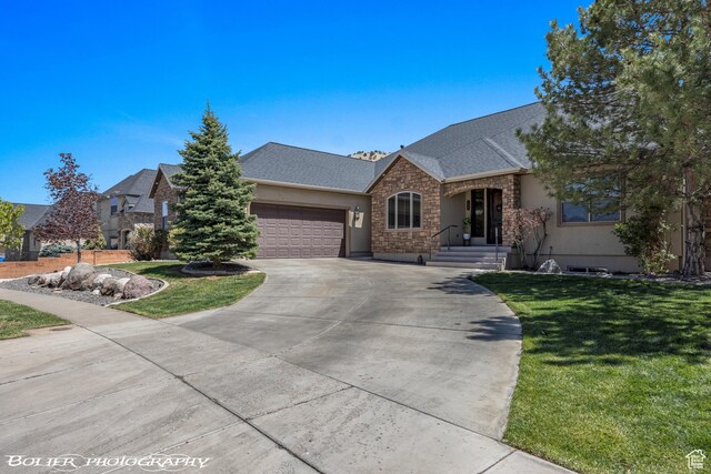 1328 N Parkside Dr, Cedar City, UT 84721 - ranch-style house with an attached garage, a front lawn, driveway, and stone siding
