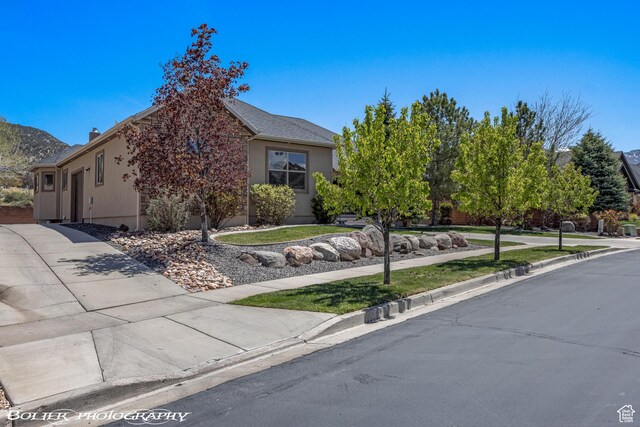 1328 N Parkside Dr, Cedar City, UT 84721 - view of front facade featuring stucco siding and concrete driveway