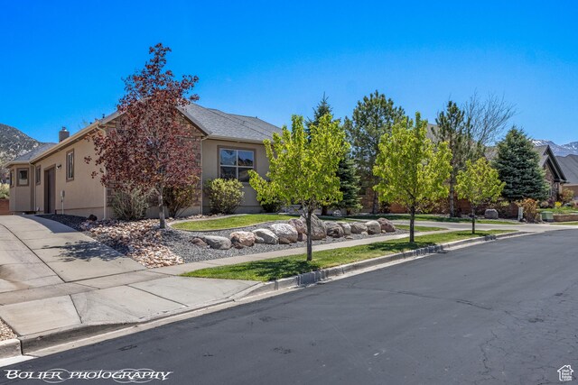 1328 N Parkside Dr, Cedar City, UT 84721 - view of front facade with a mountain view and stucco siding