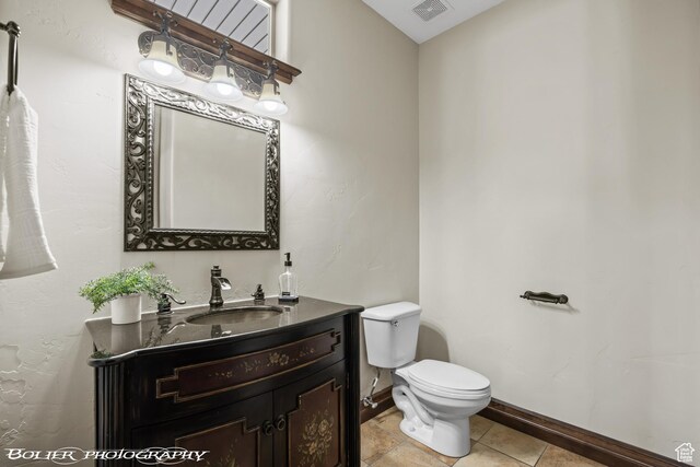 1328 N Parkside Dr, Cedar City, UT 84721 - half bath featuring visible vents, tile patterned flooring, vanity, toilet, and baseboards