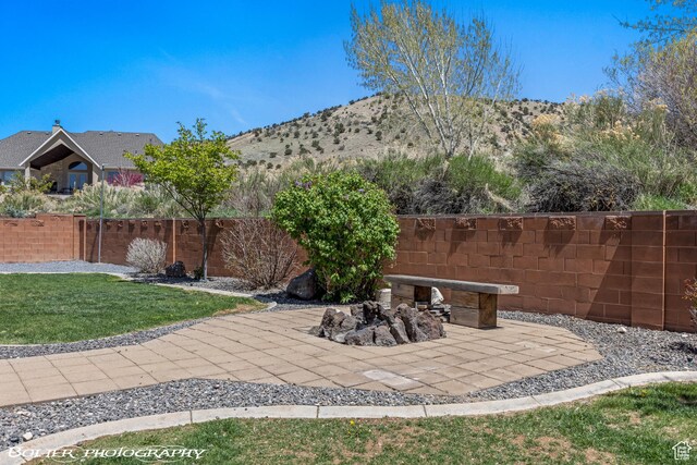 1328 N Parkside Dr, Cedar City, UT 84721 - view of yard featuring a patio, fence, and a mountain view