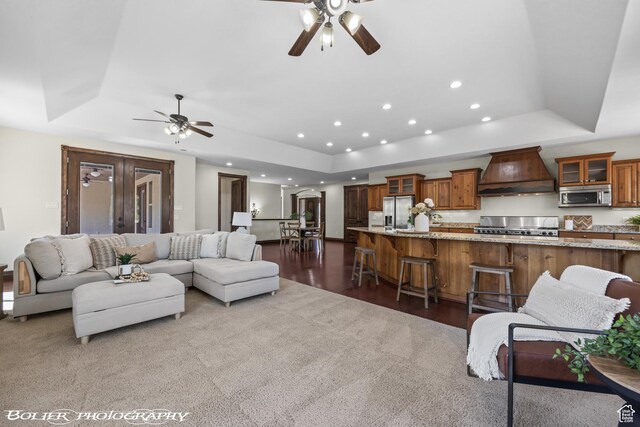 1328 N Parkside Dr, Cedar City, UT 84721 - living room with a tray ceiling, ceiling fan, and carpet