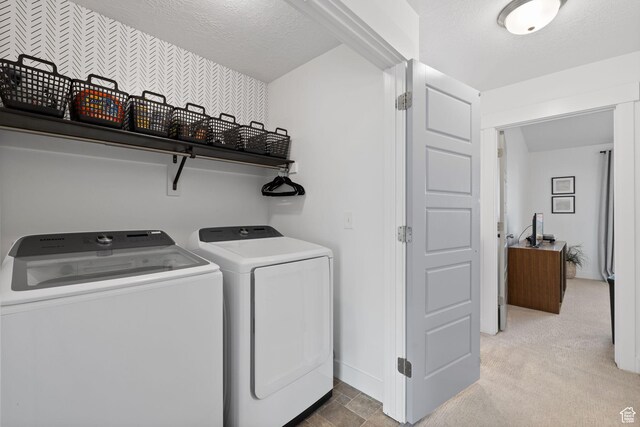 13077 S Keegan Dr, Herriman, UT 84096 - laundry area with separate washer and dryer, baseboards, laundry area, and a textured ceiling