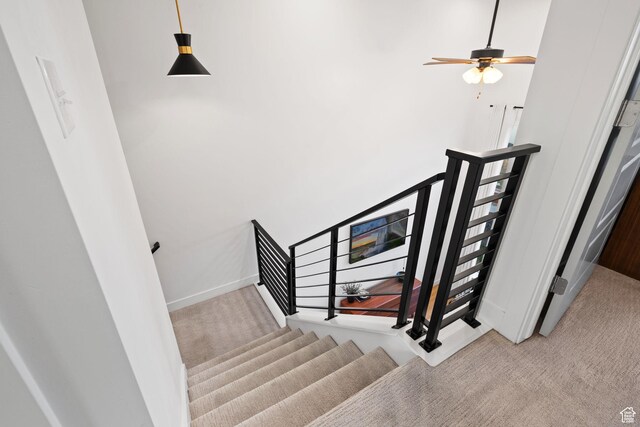 13077 S Keegan Dr, Herriman, UT 84096 - stairway with carpet floors, baseboards, a ceiling fan, and a high ceiling