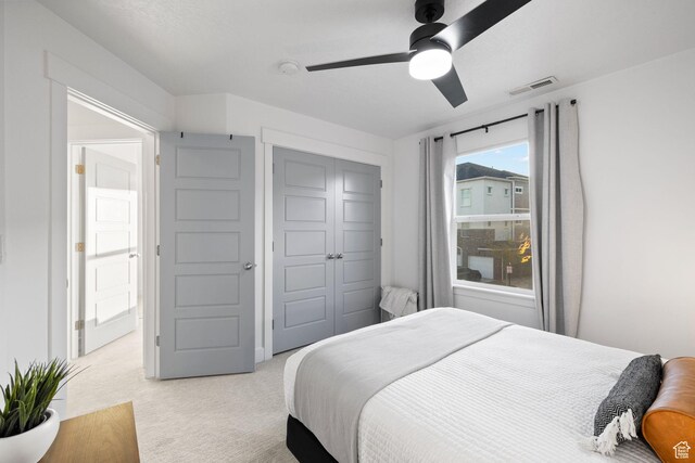 13077 S Keegan Dr, Herriman, UT 84096 - bedroom with ceiling fan, light carpet, a closet, and visible vents