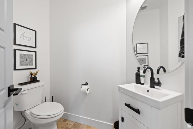 13077 S Keegan Dr, Herriman, UT 84096 - half bathroom with toilet, baseboards, visible vents, and vanity