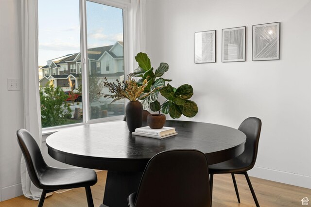 13077 S Keegan Dr, Herriman, UT 84096 - dining space with baseboards and light wood-type flooring