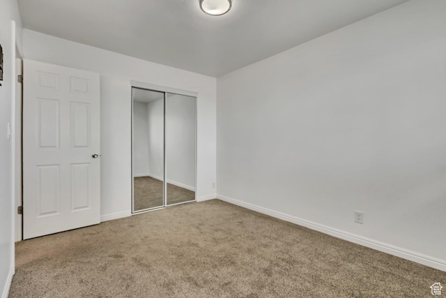 223 E Hill Ave Unit 6, Millcreek, UT 84107 - unfurnished bedroom with carpet, a closet, and baseboards