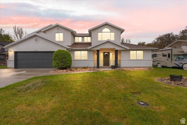 2748 W 220 N, Provo, UT 84601 - traditional-style house with a garage, a yard, stucco siding, and driveway