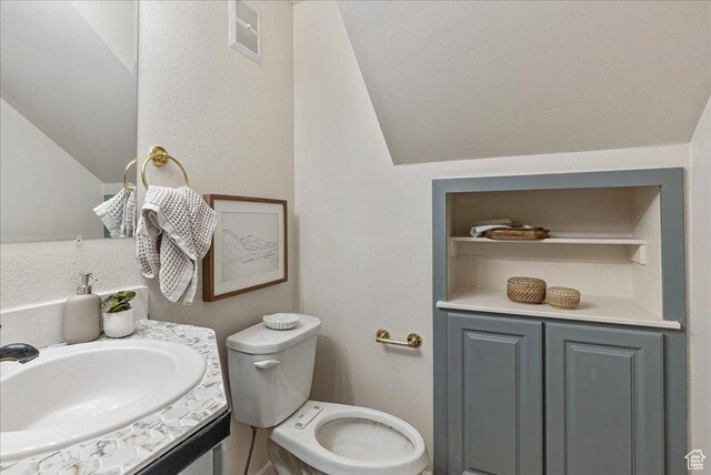 2748 W 220 N, Provo, UT 84601 - half bath with vanity, visible vents, toilet, and lofted ceiling