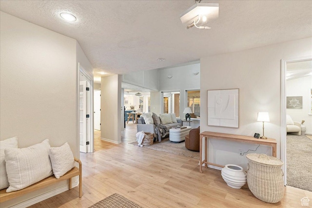 2748 W 220 N, Provo, UT 84601 - interior space with light wood-style floors, a textured ceiling, and baseboards