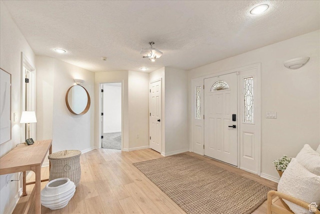 2748 W 220 N, Provo, UT 84601 - entryway with recessed lighting, a textured ceiling, baseboards, and light wood-style floors