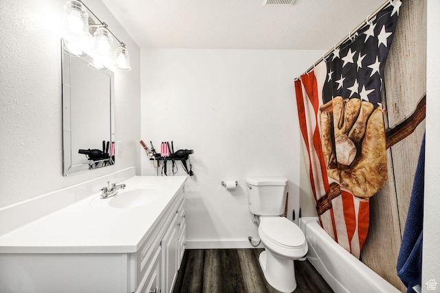 176 N Wapiti Loop E, Hyrum, UT 84319 - full bath with vanity, visible vents, wood finished floors, toilet, and baseboards