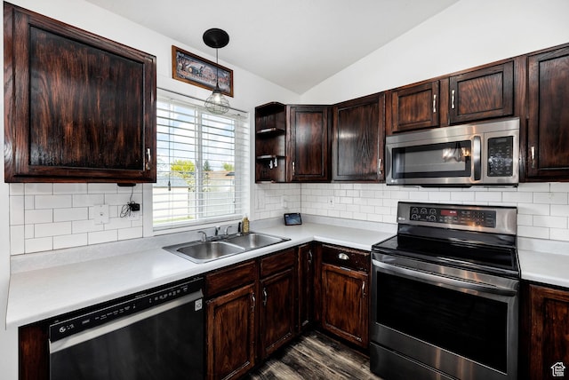 176 N Wapiti Loop E, Hyrum, UT 84319 - kitchen with dark wood-style flooring, lofted ceiling, light countertops, a sink, and appliances with stainless steel finishes