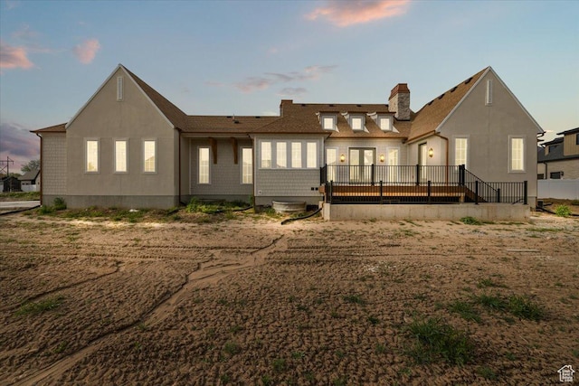 473 W 350 S Unit 31, Mapleton, UT 84664 - back of house at dusk with a wooden deck and a chimney