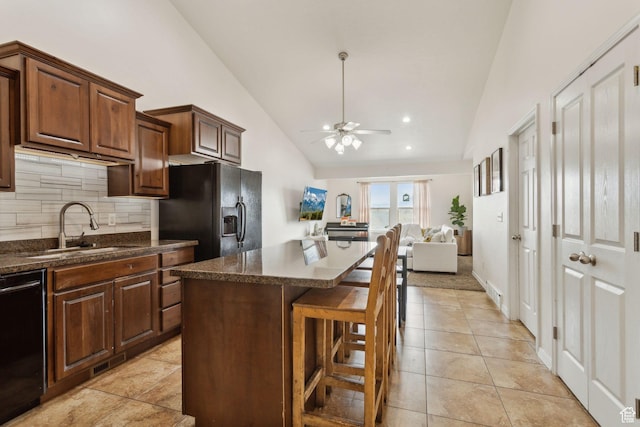 103 E River View Dr, Saratoga Springs, UT 84045 - kitchen featuring a kitchen island, ceiling fan, tasteful backsplash, a sink, and black appliances