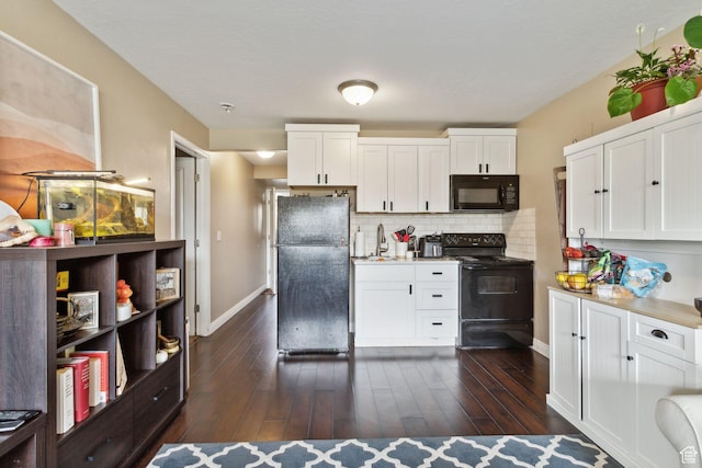 103 E River View Dr, Saratoga Springs, UT 84045 - kitchen with a sink, white cabinetry, baseboards, tasteful backsplash, and black appliances