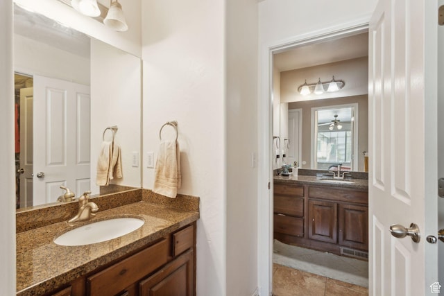 103 E River View Dr, Saratoga Springs, UT 84045 - bathroom with visible vents, a sink, two vanities, and tile patterned floors