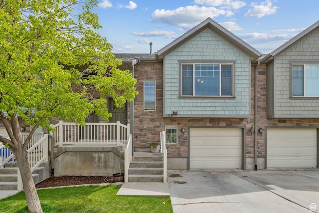 103 E River View Dr, Saratoga Springs, UT 84045 - multi unit property with driveway, stone siding, and a garage
