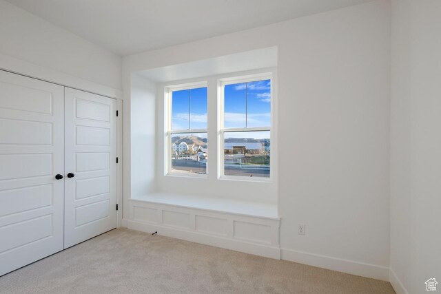 11439 S Watercourse Rd Unit 182, South Jordan, UT 84009 - unfurnished bedroom with light colored carpet and a closet