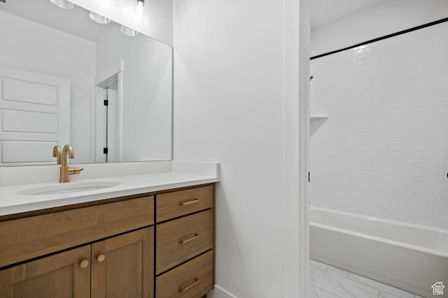 11439 S Watercourse Rd Unit 182, South Jordan, UT 84009 - bathroom featuring vanity, marble look tile flooring, tub / shower combination, and baseboards