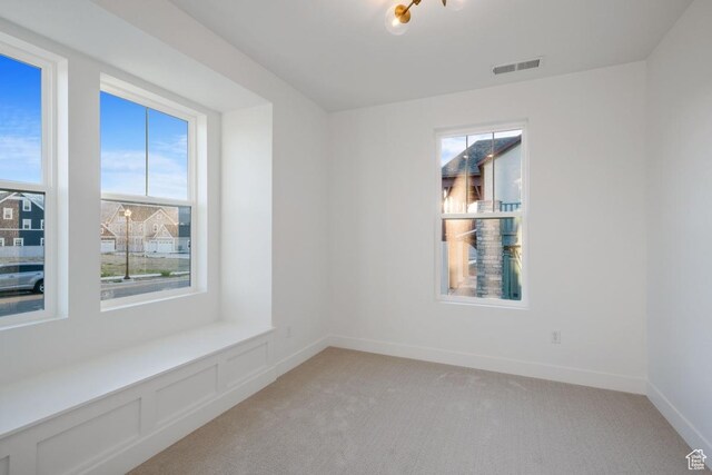 11439 S Watercourse Rd Unit 182, South Jordan, UT 84009 - spare room with light colored carpet