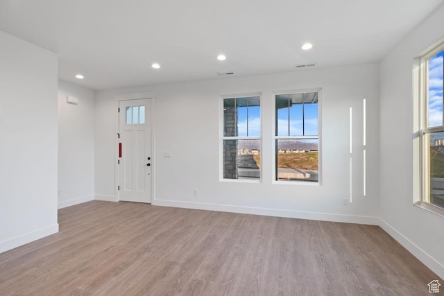 11439 S Watercourse Rd Unit 182, South Jordan, UT 84009 - entryway featuring plenty of natural light, wood finished floors, baseboards, and recessed lighting