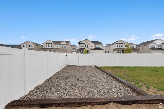838 N Marble Rd, Tooele, UT 84074 - view of yard featuring a residential view and a fenced backyard