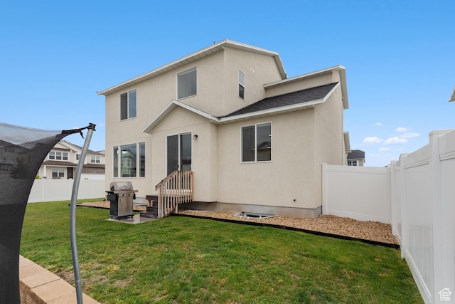 838 N Marble Rd, Tooele, UT 84074 - back of property with a lawn, a fenced backyard, and stucco siding