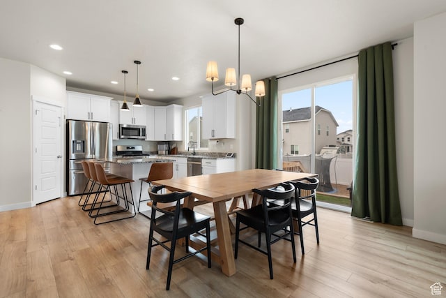 838 N Marble Rd, Tooele, UT 84074 - dining space featuring light wood-type flooring, recessed lighting, and baseboards