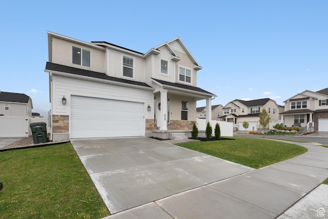 838 N Marble Rd, Tooele, UT 84074 - craftsman-style house with driveway, a front yard, a residential view, a garage, and stone siding