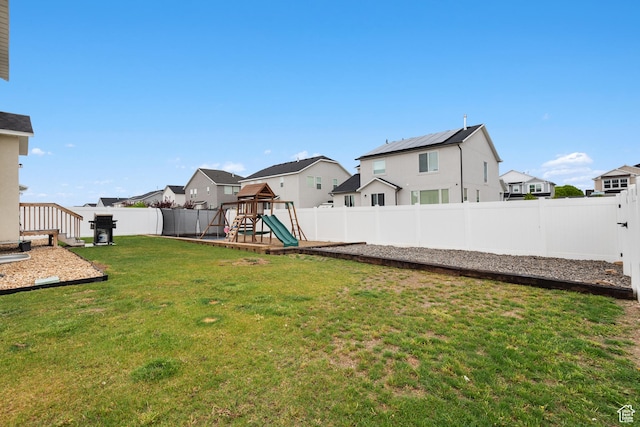 838 N Marble Rd, Tooele, UT 84074 - view of yard featuring a playground, a fenced backyard, and a residential view