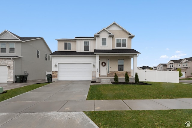 838 N Marble Rd, Tooele, UT 84074 - view of front of home with a garage, fence, a front yard, a porch, and driveway