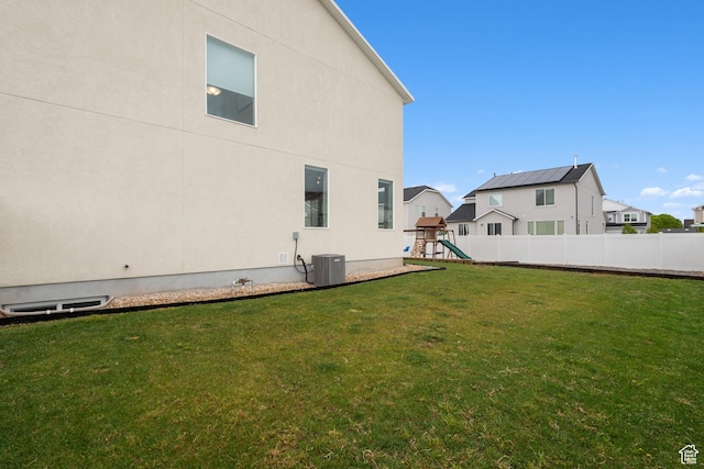 838 N Marble Rd, Tooele, UT 84074 - back of property with a playground, fence, a yard, and central AC