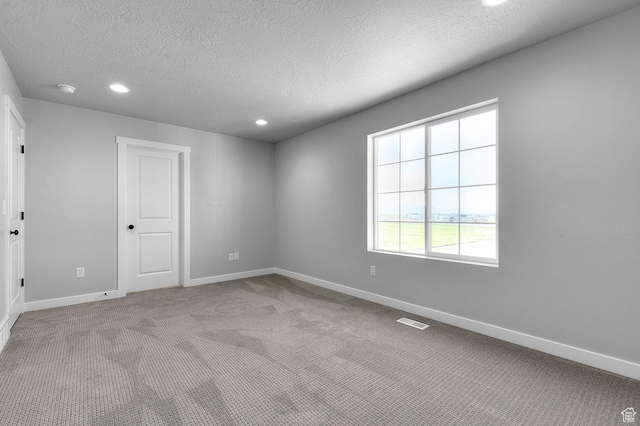 6628 W Spring Snow Ln, Herriman, UT 84096 - unfurnished room featuring a textured ceiling, carpet flooring, baseboards, and recessed lighting