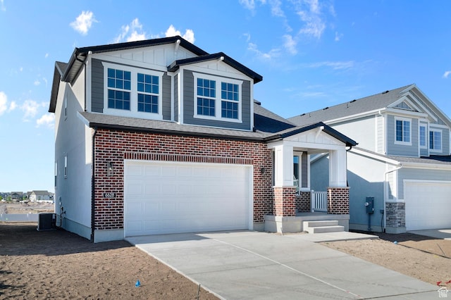 6628 W Spring Snow Ln, Herriman, UT 84096 - view of front facade featuring covered porch, a garage, driveway, and brick siding