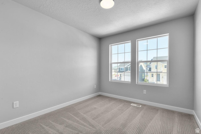 6628 W Spring Snow Ln, Herriman, UT 84096 - empty room featuring carpet, baseboards, and a textured ceiling