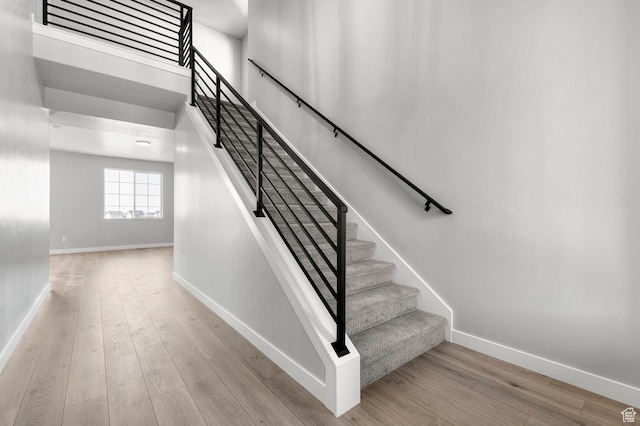6628 W Spring Snow Ln, Herriman, UT 84096 - staircase with wood finished floors and baseboards