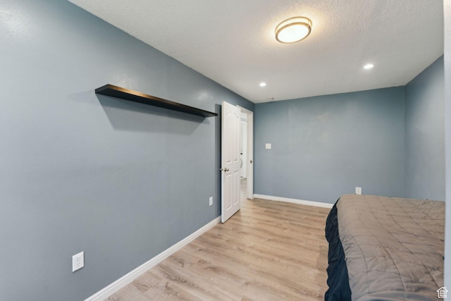 867 E 2850 N, North Ogden, UT 84414 - bedroom with a textured ceiling, baseboards, recessed lighting, and light wood finished floors