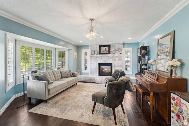 867 E 2850 N, North Ogden, UT 84414 - living area with a brick fireplace, a textured ceiling, a chandelier, ornamental molding, and dark wood-style floors