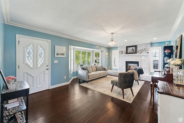 867 E 2850 N, North Ogden, UT 84414 - living room featuring ornamental molding, a textured ceiling, a notable chandelier, and hardwood / wood-style floors