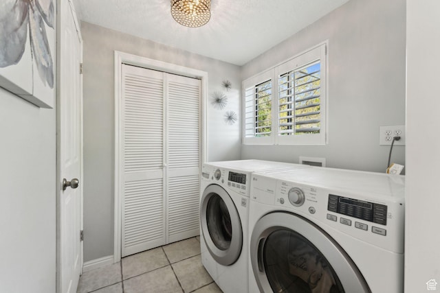 867 E 2850 N, North Ogden, UT 84414 - laundry area with laundry area, light tile patterned flooring, baseboards, washer and clothes dryer, and a textured ceiling