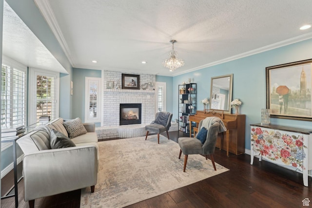 867 E 2850 N, North Ogden, UT 84414 - living area featuring a fireplace, a chandelier, baseboards, wood finished floors, and ornamental molding