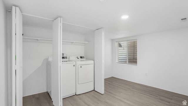 10674 S Pine Shadow Rd, South Jordan, UT 84009 - washroom featuring laundry area, light wood-type flooring, and washing machine and clothes dryer