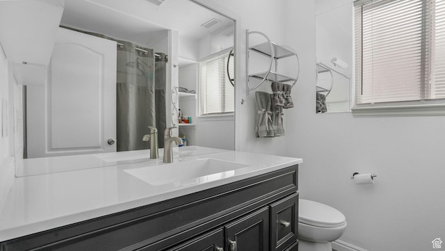 10674 S Pine Shadow Rd, South Jordan, UT 84009 - full bath featuring vanity, plenty of natural light, toilet, and curtained shower