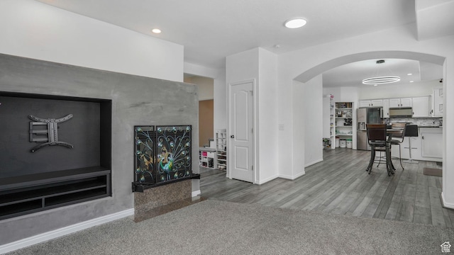 10674 S Pine Shadow Rd, South Jordan, UT 84009 - living area with arched walkways, baseboards, recessed lighting, and wood finished floors