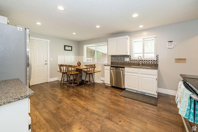75 S 300 W, Morgan, UT 84050 - kitchen with white cabinets, appliances with stainless steel finishes, a sink, recessed lighting, and dark wood-type flooring