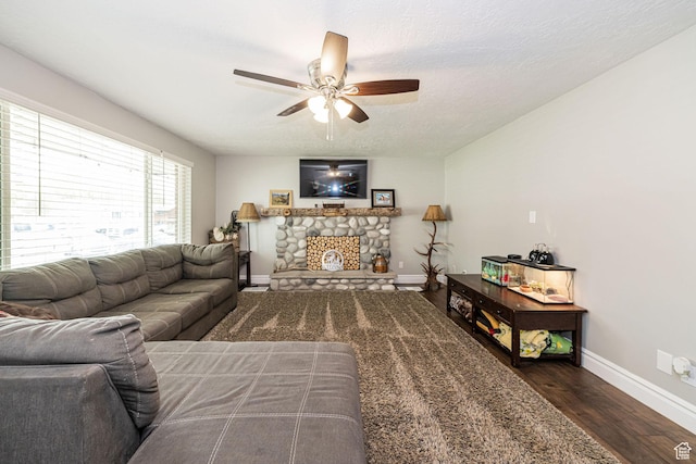 75 S 300 W, Morgan, UT 84050 - living area featuring a ceiling fan, baseboards, a stone fireplace, and wood finished floors