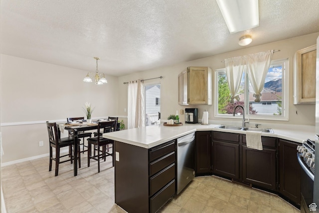 668 N 1370 W, Pleasant Grove, UT 84062 - kitchen featuring a textured ceiling, appliances with stainless steel finishes, a sink, light countertops, and a peninsula