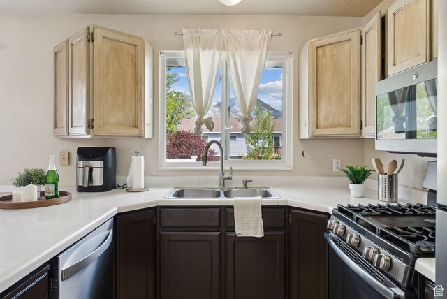 668 N 1370 W, Pleasant Grove, UT 84062 - kitchen with a sink, appliances with stainless steel finishes, light brown cabinetry, and light countertops
